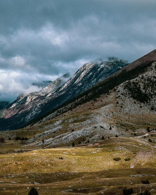 Scenic mountain landscape with clouds in Bosnia and Herzegovina, showcasing nature's beauty.