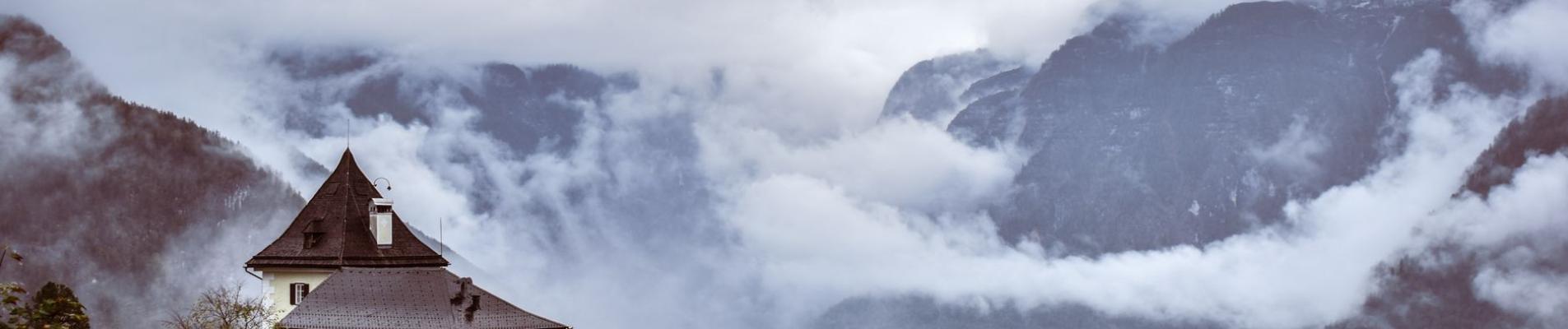 Beautiful mountain landscape with a bridge and clouds in Hallstatt, Austria.
