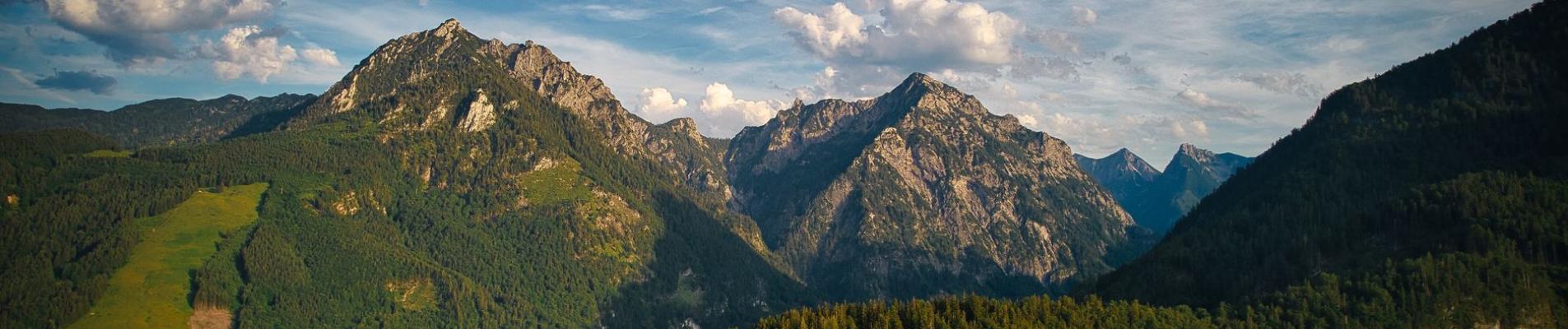 Breathtaking panorama of Sparberegg in Styria with clear skies and lush forests.