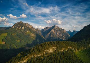 Breathtaking panorama of Sparberegg in Styria with clear skies and lush forests.