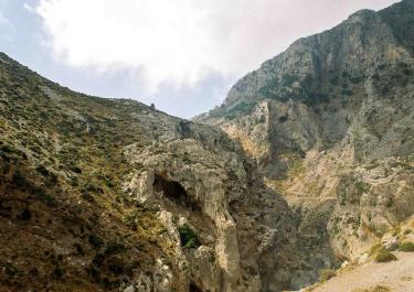 Explore the eroded rocky landscape and mountains of Greece, capturing natural beauty.